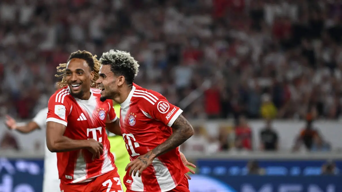 Bayern Munich's French defender #23 Sacha Boey and Bayern Munich's Colombian forward #14 Luis Diaz celebrate the 0-2 during the Franz-Beckenbauer Supercup football match between VfB Stuttgart and FC Bayern Munich in Stuttgart, southern Germany on August 16, 2025. Originally established in 1987 by the German Football Association (DFB) as the as the DFB-Supercup, The Franz Beckenbauer Supercup, is a single football match between the Bundesliga champion and the DFB-Pokal winner, organized by the German Football League (DFL). (Photo by THOMAS KIENZLE / AFP) / DFL REGULATIONS PROHIBIT ANY USE OF PHOTOGRAPHS AS IMAGE SEQUENCES AND/OR QUASI-VIDEO