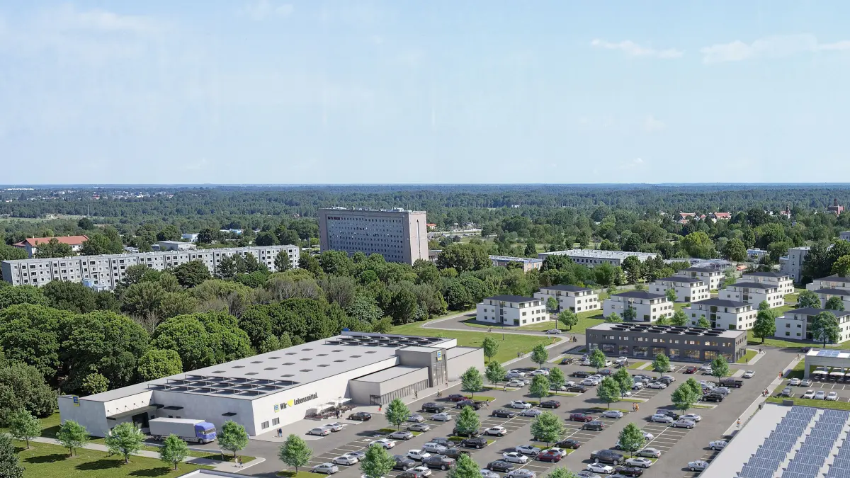 Diese Visualisierung zeigt das derzeit brach liegende Areal an der Claus-von-Stauffenberg-Straße und der Spremberger Chaussee, wie es mit Edeka, Jysk und Aldi sowie mit Stadtvillen (Hintergrund) bebaut werden soll.