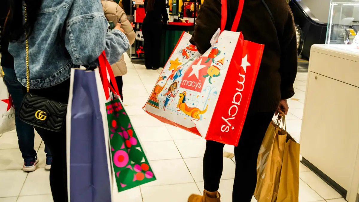 Shoppers Kick Off The Holiday Buying Season, Looking For Black Friday Deals: PARAMUS, NEW JERSEY - NOVEMBER 28: People carry shopping bags during Black Friday shopping at Garden State Plaza on November 28, 2025 in Paramus, New Jersey. According to the the National Retail Federation, nearly 187 million people are expected to shop between Thanksgiving and Cyber Monday this year. Eduardo Munoz Alvarez/Getty Images/AFP (Photo by EDUARDO MUNOZ ALVAREZ / GETTY IMAGES NORTH AMERICA / Getty Images via AFP)