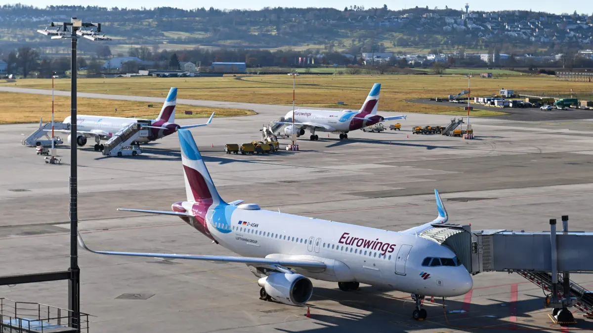 An Airbus A320-214 passenger plane of German airline Eurowings stands on the tarmac of Stuttgart Airport (STR) in Stuttgart, southwestern Germany, on December 15, 2025. (Photo by THOMAS KIENZLE / AFP)