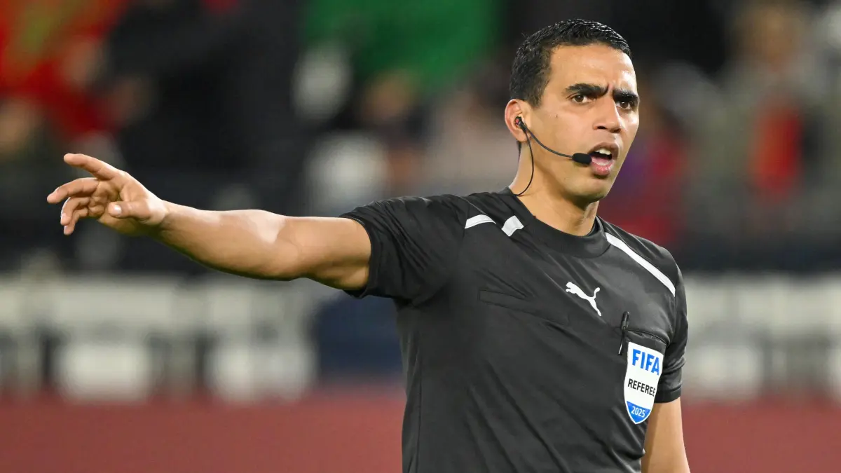 Morocco referee Jalal Jayed reacts during the Africa Cup of Nations (CAN) Group C football match between Uganda and Tanzania at Al Medina Stadium in Rabat on December 27, 2025. (Photo by SEBASTIEN BOZON / AFP)