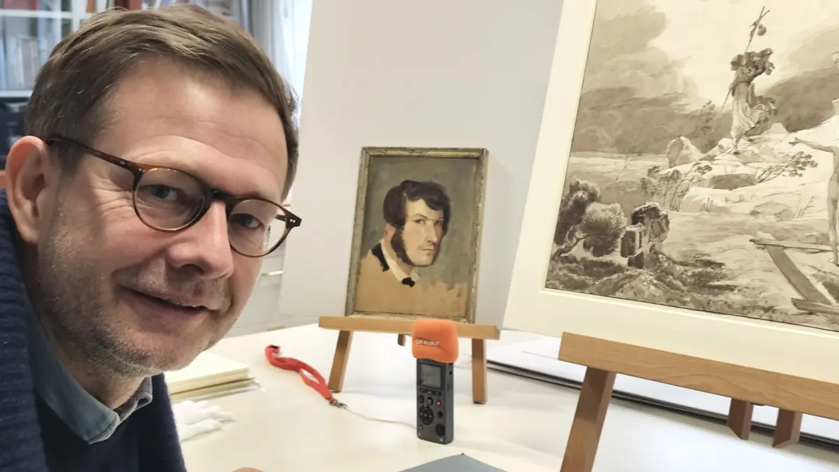Beim Gespräch in der Kunstsammlung der Akademie der Künste in Berlin schaut Carl Blechen in einem seiner wenigen Selbstporträt zu.