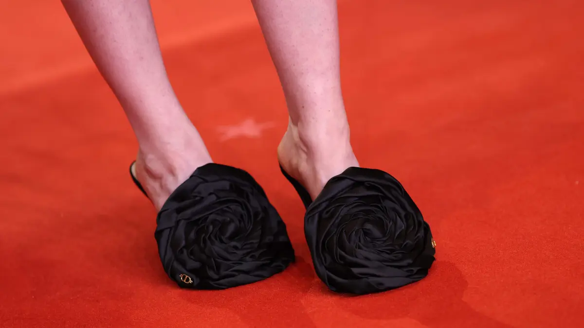 776458798: The shoes of German actress Lena Urzendowsky are pictured as she arrives on the red carpet for the premiere of the film "No Good Men" presented in the Berlinale Special Gala section and opening the 76th Berlinale, Europe's first major film festival of the year, in Berlin on February 12, 2026. (Photo by Ronny HARTMANN / AFP)