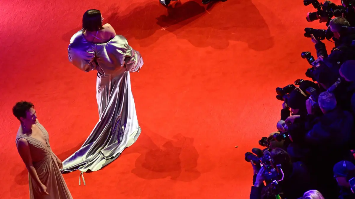 776458798: Guests pose for photographers as they arrive on the red carpet for the premiere of the film "No Good Men" presented in the Berlinale Special Gala section and opening the 76th Berlinale, Europe's first major film festival of the year, in Berlin on February 12, 2026. (Photo by John MACDOUGALL / AFP)