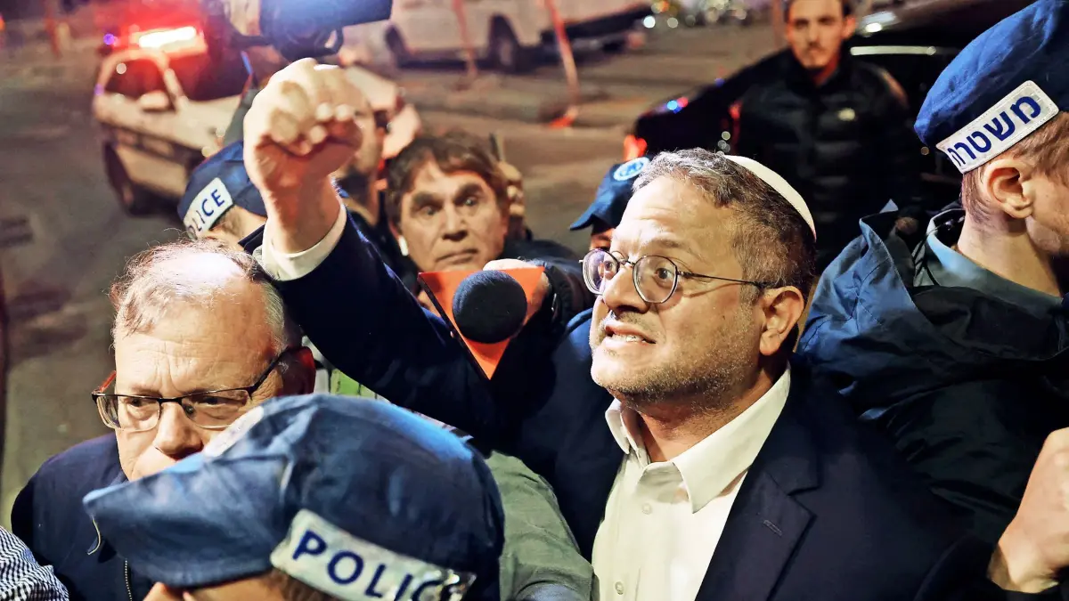 EDITORS NOTE: Graphic content / Israeli Minister of National Security Itamar Ben-Gvir speaks to bystanders as he walks to the site of a reported attack in a settler neighborhood in Israeli-annexed East Jerusalem on January 27, 2023. - At least seven people were killed in a shooting outside a synagogue in Israeli-annexed east Jerusalem on Friday January 27, 2023, with the gunman killed at the scene, police and medics said.
"Earlier this evening at around 8:30 pm (1830 GMT), a terrorist arrived at a synagogue in the Neve Yaakov boulevard in Jerusalem and proceeded to shoot at a number of people in the area," a police statement said. (Photo by AHMAD GHARABLI / AFP)