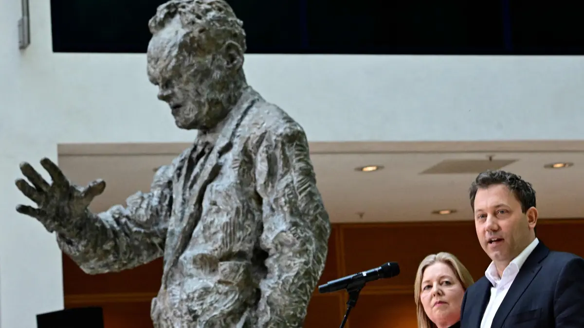 Germany's social democratic SPD party's co-leaders Baerbel Bas (2nd R) and Lars Klingbeil (R) stand next to a statue of former SPD leader Willy Brandt as they give a statement at their party's headquarters in Berlin on March 23, 2026, one day after state elections in the southwestern state of Rhineland-Palatinate. German Chancellor Friedrich Merz's conservative CDU party ousted the centre-left Social Democratic Party in the closely watched state election in which the far right also made big gains, according to exit polls. (Photo by Tobias SCHWARZ / AFP)