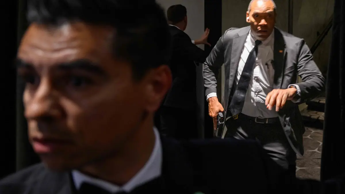 White House Correspondents' Association Dinner: Agents draw their guns after loud bangs were heard during the White House Correspondents' dinner at the Washington Hilton in Washington, DC, on April 25, 2026. US Secret Service agents bundled Donald Trump from the stage as shots rang out Saturday evening at a media gala, in what the president later described as an attack by a "would-be assassin." Armed guards opened fire at the gunman who charged through a security checkpoint just outside the ballroom of the hotel where Trump, First Lady Melania Trump, senior government officials and hundreds of other black-tie guests had gathered. (Photo by Mandel NGAN / AFP)