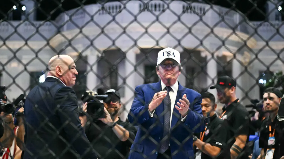 776510421: US President Donald Trump stands in The Octagon with UFC CEO Dana White at the conclusion of the "UFC Freedom 250" mixed martial arts event on the South Lawn of the White House in Washington, DC, in the early morning hours of June 15, 2026. (Photo by Kent NISHIMURA / AFP)