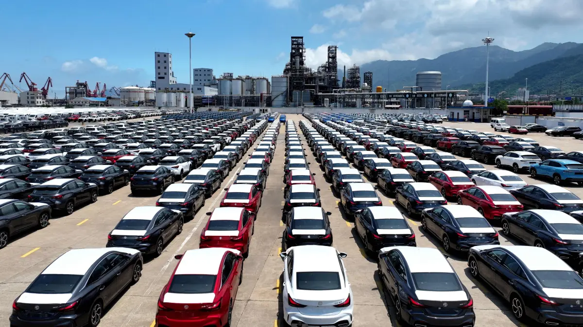 CHINA-ECONOMY-TRADE-AUTO: Chinese-made MG cars are seen on a dock before being loaded onto a ship for export, at the port in Lianyungang, in China’s eastern Jiangsu province on June 17, 2026. (Photo by CN-STR / AFP) / China OUT