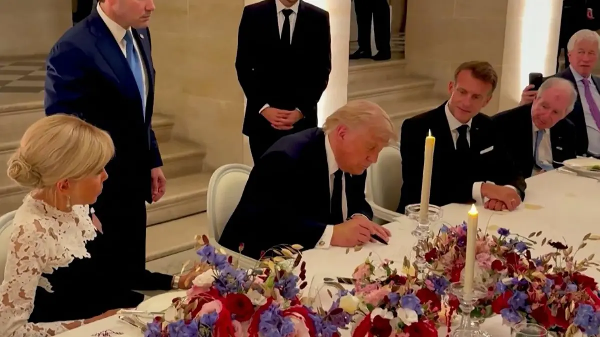 FRANCE-US-IRAN-POLITICS-DIPLOMACY: This screengrab from videofootage made available on June 18, 2026, from the X account of Deputy Chief of Staff at The White House Dan Scavino shows US President Donald Trump (C) next to France's President Emmanuel Macron (R), his wife Brigitte Macron (L), US Secretary of State Marco Rubio and France's Foreign Affairs Minister Jean-Noel Barrot during the signing of a deal with Iran to end the Middle East war, inside Chateau de Versailles, in Versailles southwest of Paris on June 17, 2026. (Photo by @Scavino47 / AFP) / XGTY - RESTRICTED TO EDITORIAL USE - MANDATORY CREDIT « AFP PHOTO / @Scavino47 » - NO MARKETING NO ADVERTISING CAMPAIGNS - DISTRIBUTED AS A SERVICE TO CLIENTS - NO ARCHIVE