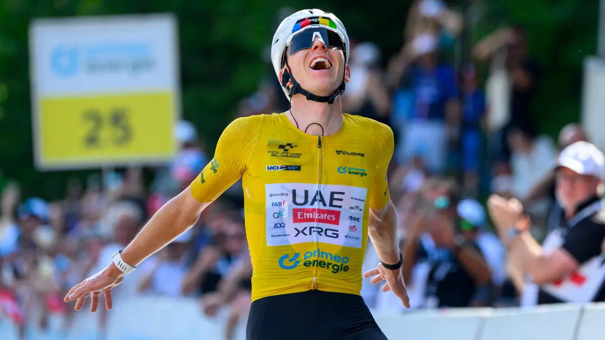 CYCLING-SUI-TOUR-MEN: UAE Team Emirates - XRG team's Slovenian rider Tadej Pogacar celebrates as he crosses the finish line to win the fith and final stage of the Men's Tour of Switzerland (Tour de Suisse) cycling race, 150.7 km starting and finishing in Villars-sur-Ollon on June 21, 2026. (Photo by Harold Cunningham / AFP)
