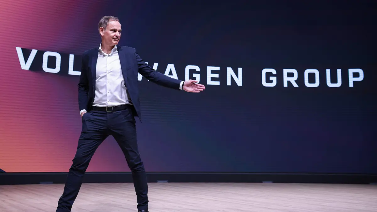 FILES-GERMANY-ECONOMY-AUTOMOBILE-LAYOFFS-VOLKSWAGEN: (FILES) German carmaker Volkswagen (VW) CEO Oliver Blume leaves the podium after an annual news conference to present the company's results at the company's headquarters in Wolfsburg, central Germany, on March 11, 2025. German auto giant Volkswagen's management meet on July 9, 2026 to thrash out plans for what could be the biggest ever restructuring in the global auto industry with unions set to protest any mass job cuts. (Photo by Ronny HARTMANN / AFP)
