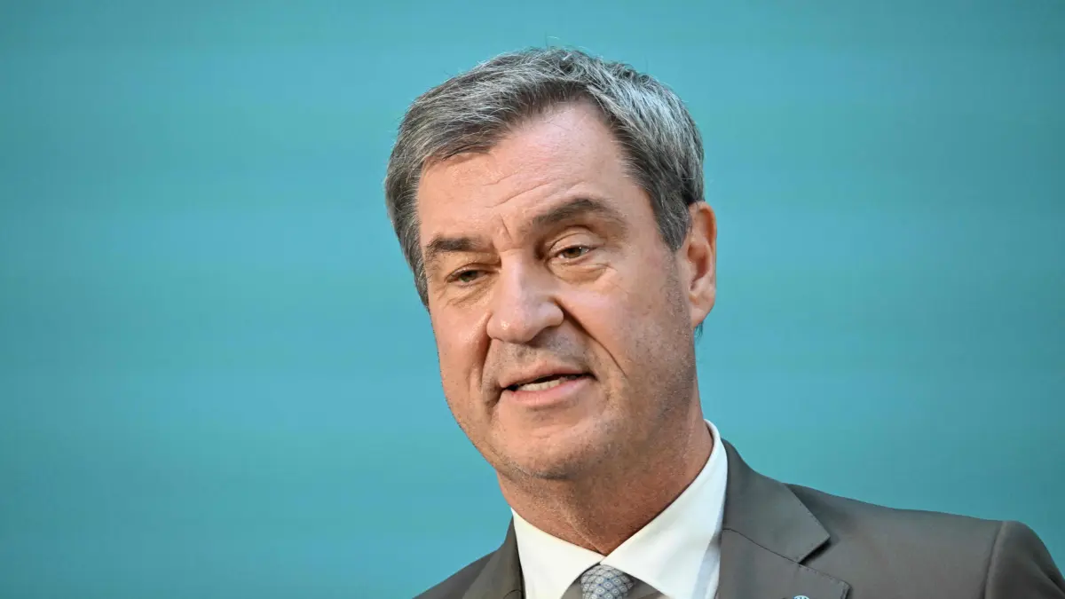 GERMANY-PARTIES-PARLIAMENT-CDU-CSU: Bavaria's State Premier and leader of the conservative Christian Social Union (CSU) Markus Soeder speaks during a join press statement after the conservative CDU/CSU parliamentary group elected their new leader, on July 29, 2026 at the Jakob-Kaiser-Haus, that is part of the parliamentary compound in Berlin. (Photo by RALF HIRSCHBERGER / AFP)