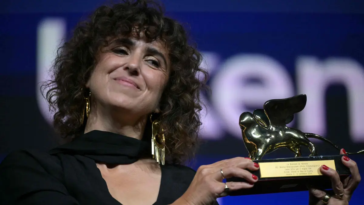 776562204: Danish director May El-Toukhy is congratulated by the president of the jury Maggie Gyllenhall as she receives the Golden Lion for Best Film for "Kvinde Ukendt" (Woman unknown) during the closing ceremony of the 63rd Venice Film Festival at Venice Lido on September 12, 2026. (Photo by Stefano Rellandini / AFP)