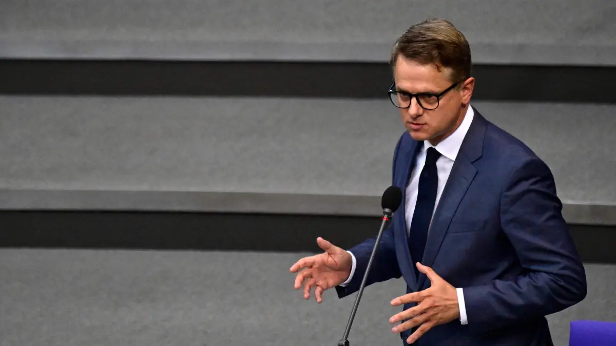 GERMANY-POLITICS-PARLIAMENT-DEFENCE: German Health Minister Carsten Linnemann addresses MPs during a session of the Bundestag (lower house of parliament) on September 23, 2026 in Berlin. (Photo by John MACDOUGALL / AFP)